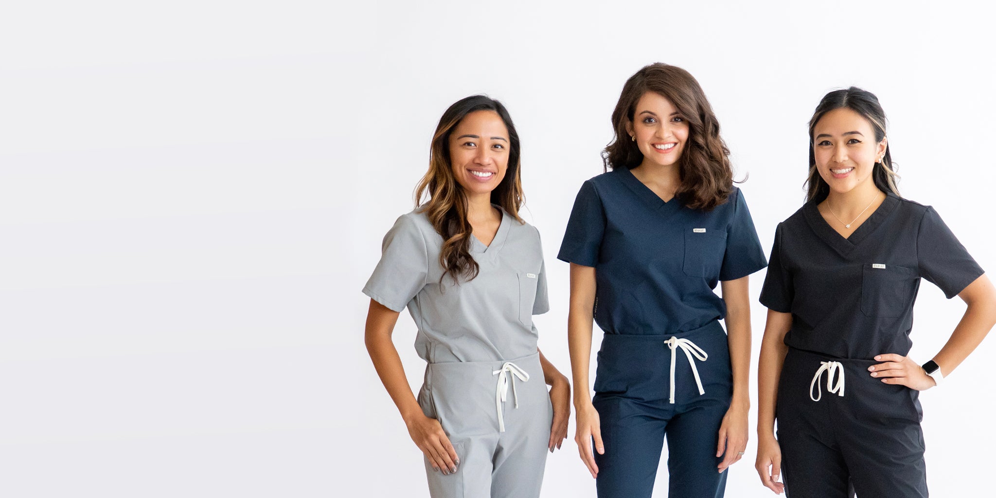 Womens scrubs in grey, navy, and black